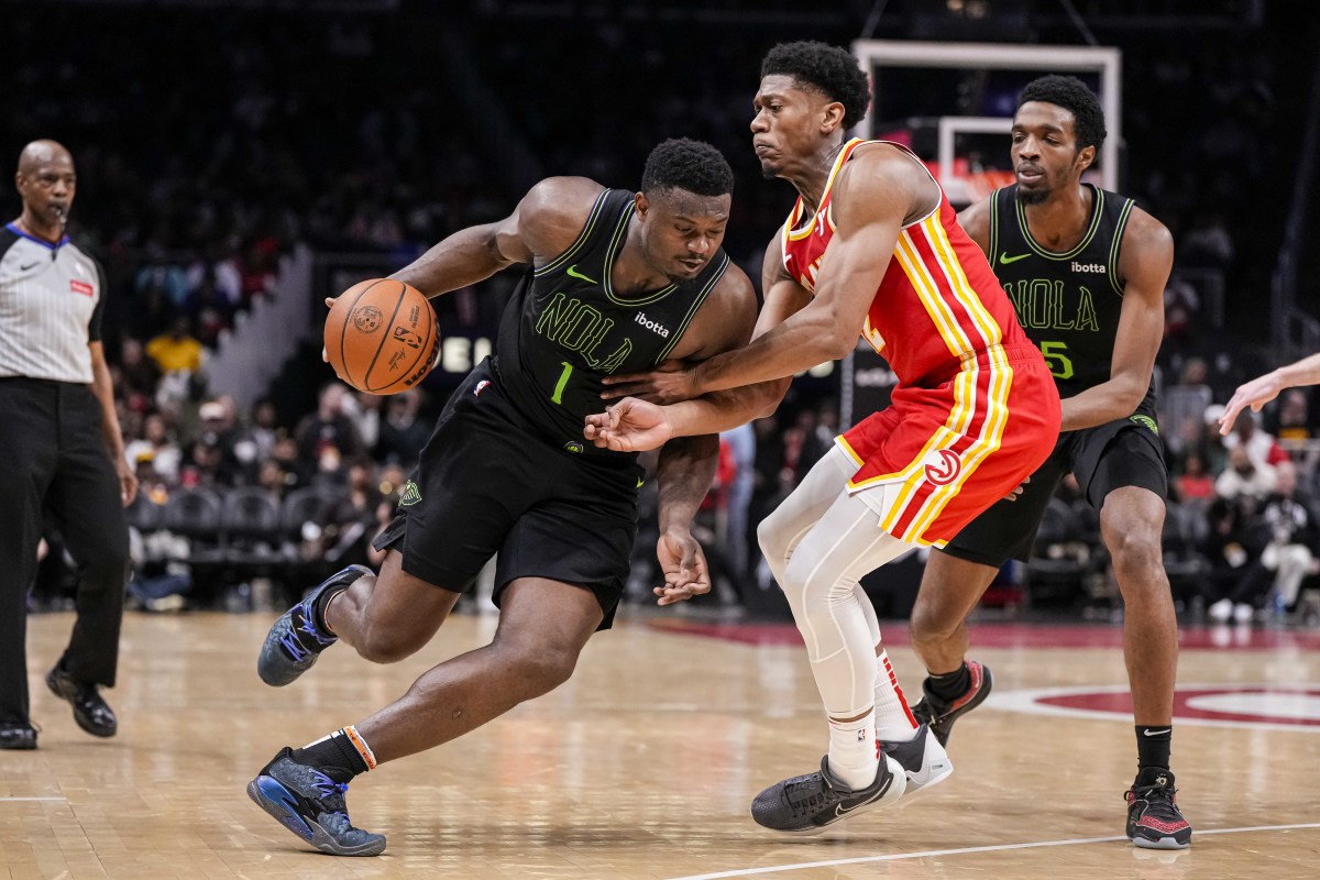 Mar 10, 2024; Atlanta, Georgia, USA; New Orleans Pelicans forward Zion Williamson (1) dribbles against Atlanta Hawks forward De'Andre Hunter (12) during the second half at State Farm Arena. Mandatory Credit: Dale Zanine-USA TODAY Sports